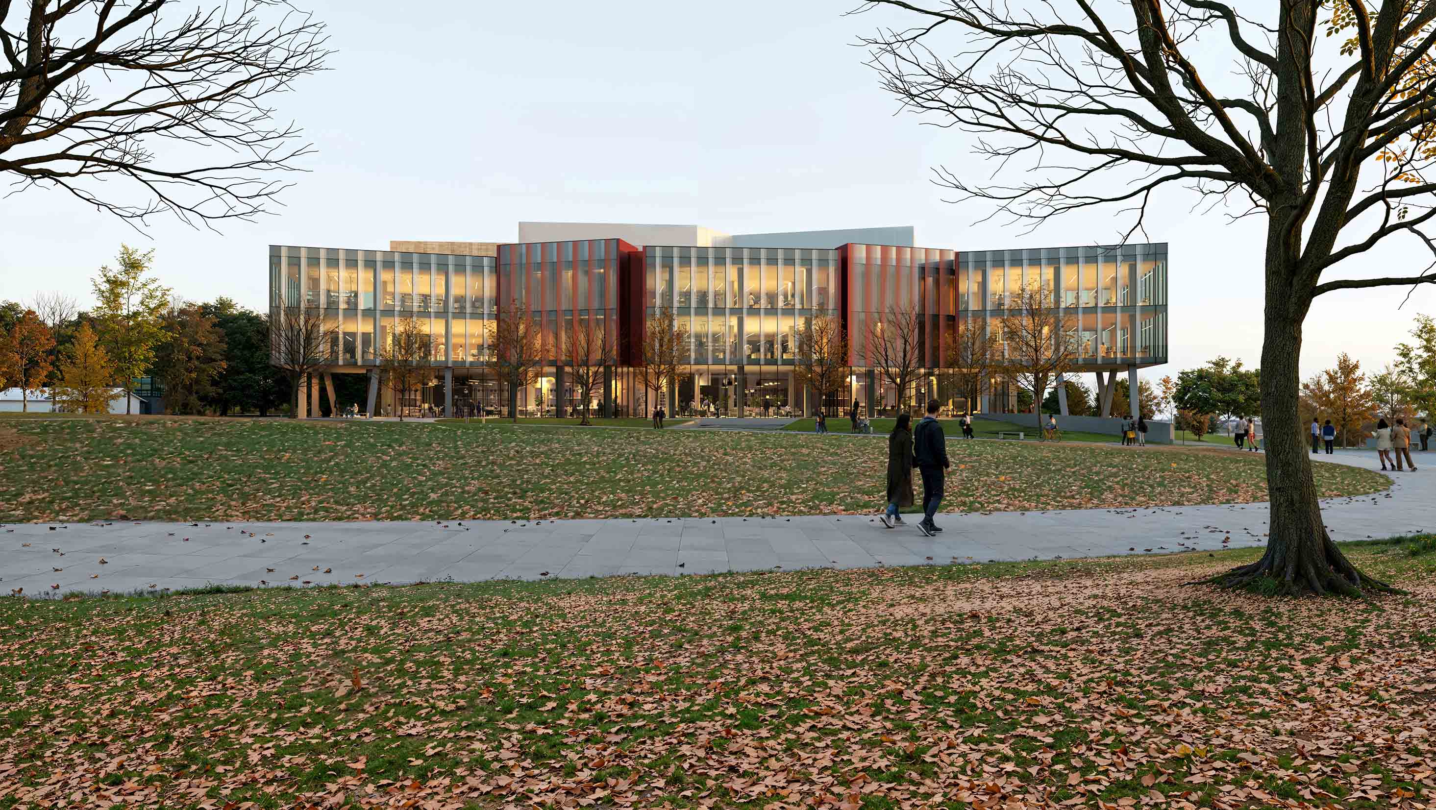 Architectural rendering of a large building with interior lights on and a foreground with people walking on a sidewalk framed by two trees.